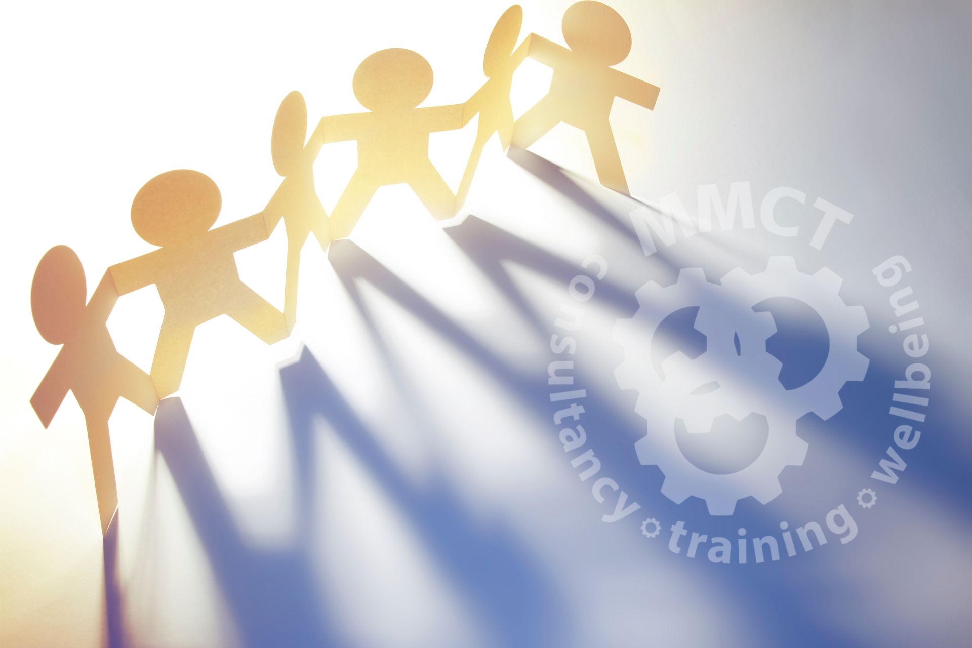 About us slide featuring a chain of paper cut people and the MMCT logo featured bottom right